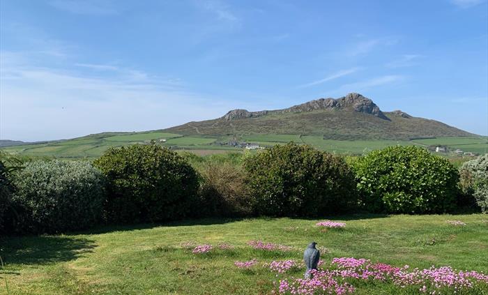 Guests can relax and enjoy, one of the two gardens, this one does have a lovely mountain and sea view.